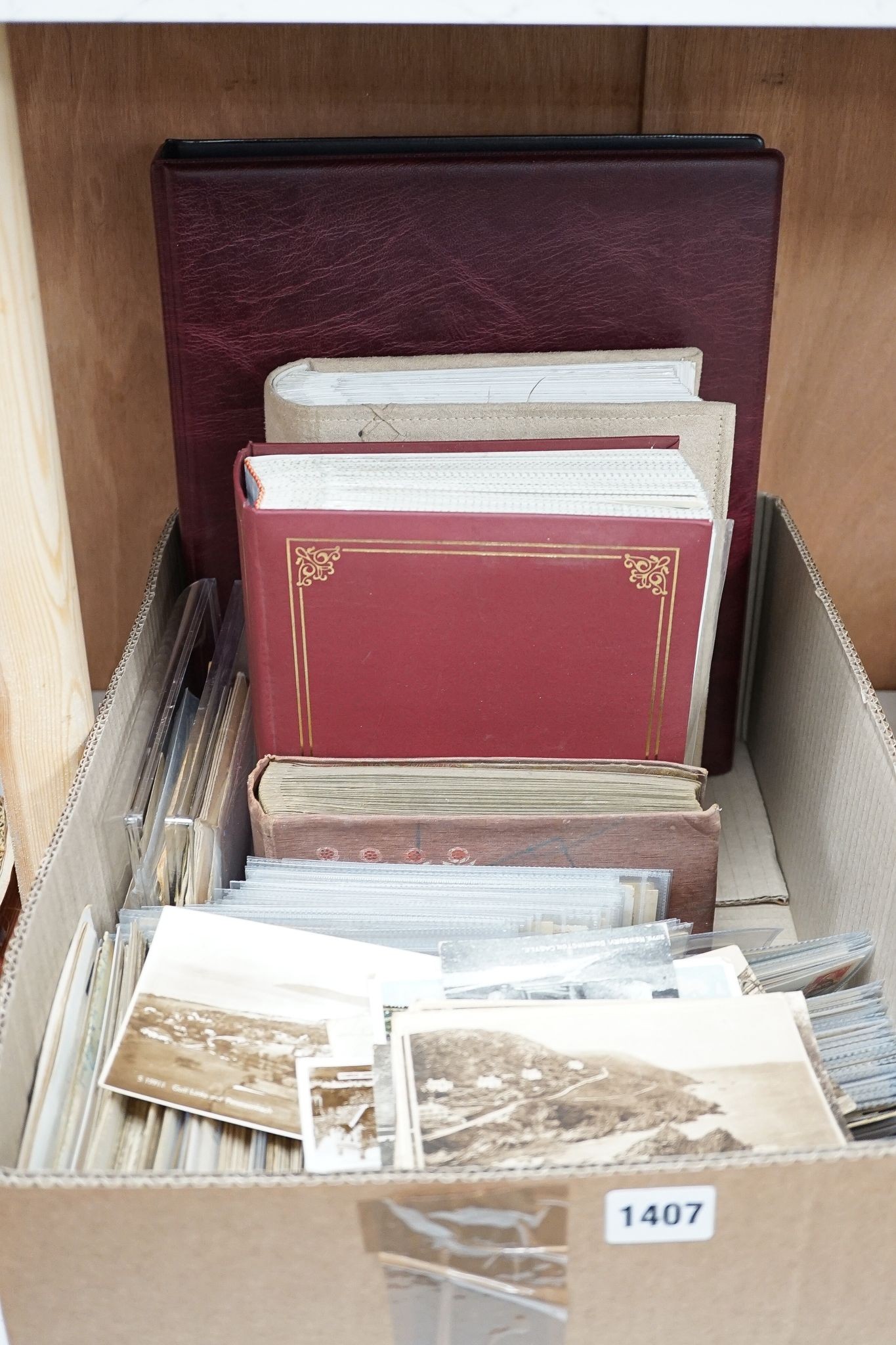 Four albums of postcards and a large collection of loose postcards, mainly British topographical, Victorian cabinet photographs, etc.